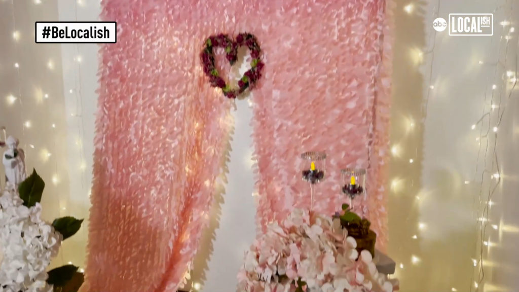 a picture of the Long Island Wedding Chapel's altar featuring a red heart, pink background and white decorative lights